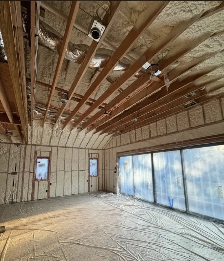 Interior walls and ceiling insulated with spray foam during new construction in Greenwich